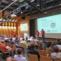 Decorative image for sidebar: organisers on stage